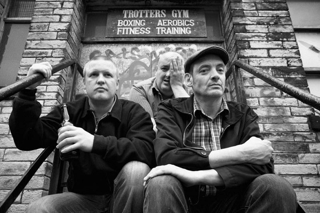 London Oi! band Hard Skin looking moody and tough in front of an old brick building