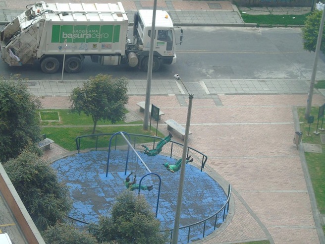 Garbage men on swings