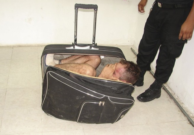 Man in suitcase